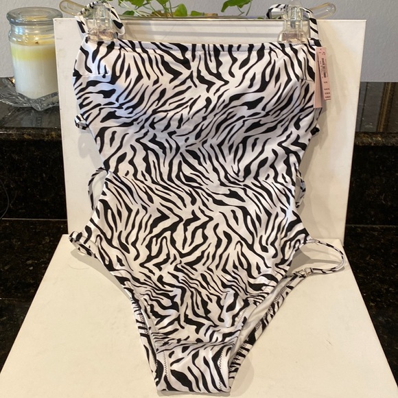 Victoria's Secret Other - NWT VICTORIA SECRET’S ZEBRA ONE PIECE BEAUTY- WITH OPEN BACK AND SIDES gold trim